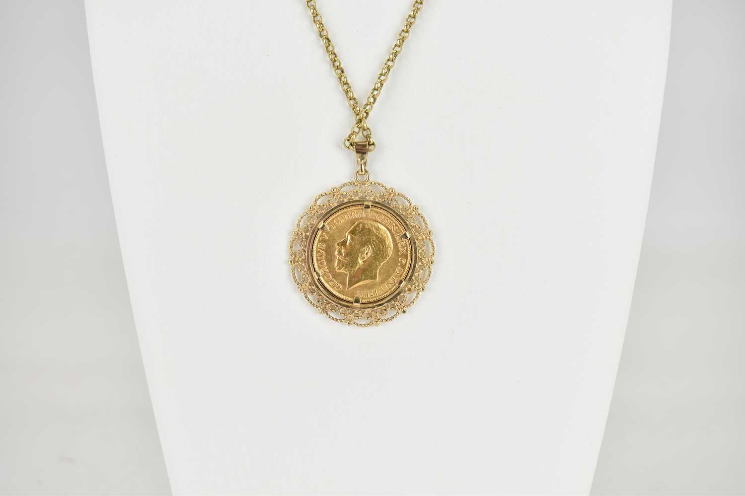 A George V 1925 full sovereign in a 9ct gold circular pendant mount with open scrollwork, - Image 3 of 3