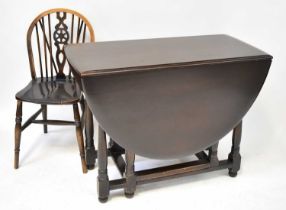 A 20th century drop-leaf supper table, 77 x 104 x 49cm (when closed), together with a set of six