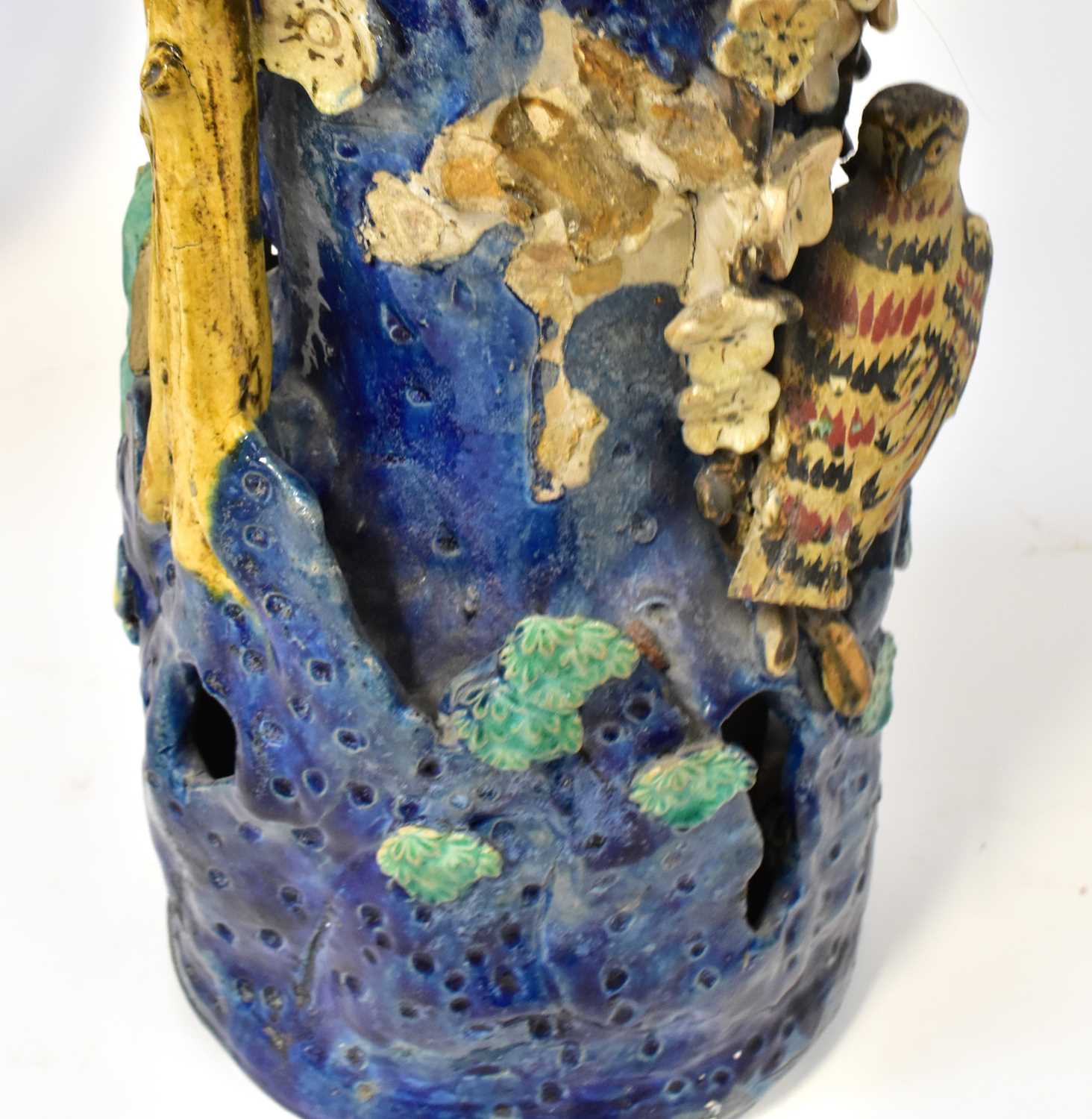 A pair of Chinese-style Shiwan pottery vases modelled with figures in a tree, on a blue ground - Image 4 of 4