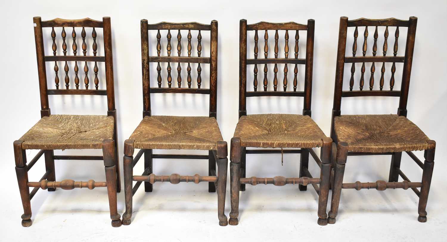 A 19th century oak plank top refectory table on carved cup and cover legs united by a stretcher, - Image 2 of 6