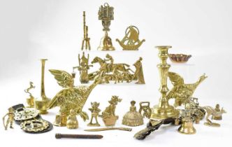 A small mixed lot of brass, to include a candlestick, horse brasses, bells, etc.