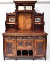 A Victorian mahogany mirror back dresser, the upper section with broken arched pediment above