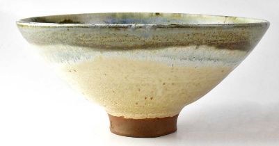 † MARTIN SILBER; a studio pottery bowl of conical footed form with blue, green, brown and cream