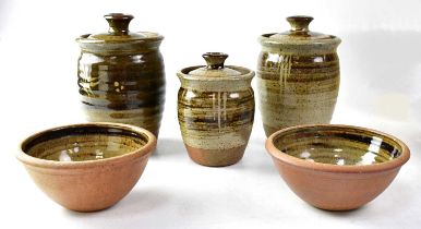† ROGER COCKRAM (born 1947); three stoneware caddies and two bowls, with impressed 'RJC' marks,