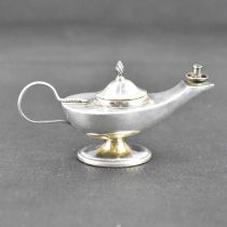 ADIE & LOVEKIN LTD; a George V hallmarked silver miniature Aladdin's lamp with flame finial to the