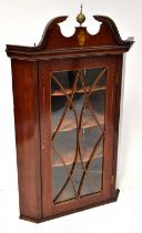 A Regency mahogany inlaid and line inlaid glazed flat-fronted wall-hanging corner cupboard with