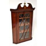 A Regency mahogany inlaid and line inlaid glazed flat-fronted wall-hanging corner cupboard with