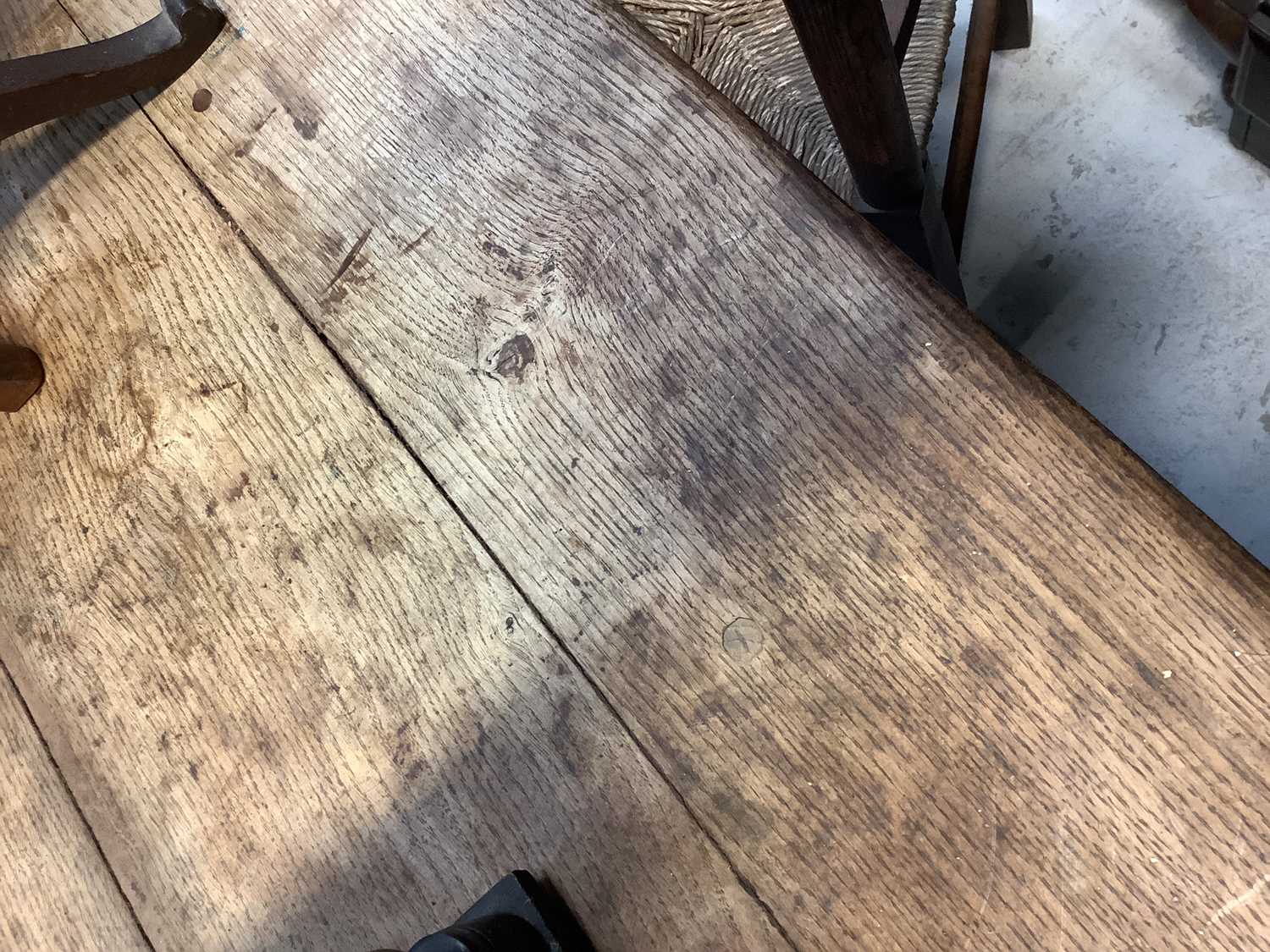 A 19th century oak plank top refectory table on carved cup and cover legs united by a stretcher, - Image 4 of 6