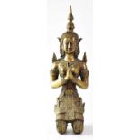 A bronze figure of a Thai temple watcher in the form of a kneeling female figure in ornate dress,