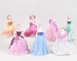 COALPORT; seven small porcelain figures comprising, Debutantes 'Nina', 'Miranda', 'In Love', '