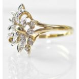 A 9ct gold ring set with small diamonds in foliate style, stamped 375, size Q, approx. 2.4g.