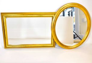 Two modern gilt wood mirrors comprising an oval example, 70 x 60cm, and a rectangular bevel edge