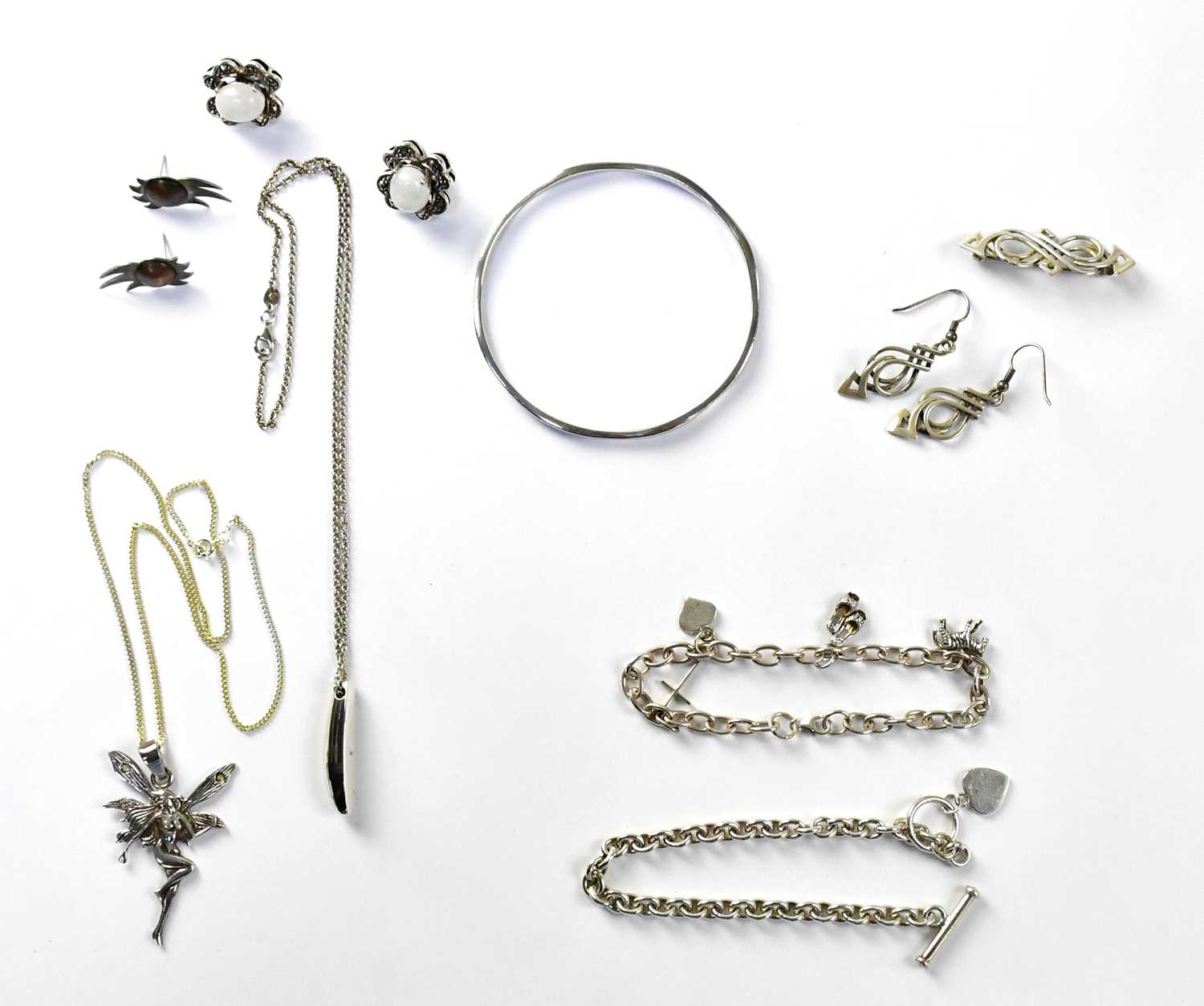 A group of 925 silver jewellery, to include a bangle, a bracelet set with four charms, a further