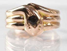 A 9ct yellow gold snake ring, the head set with a 0.15ct gemstone, size S, approx. 2.7g.