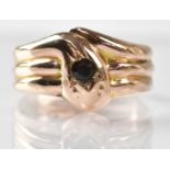 A 9ct yellow gold snake ring, the head set with a 0.15ct gemstone, size S, approx. 2.7g.