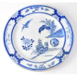 A 19th century Chinese blue and white charger painted with Asiatic pheasants in a pen, within a