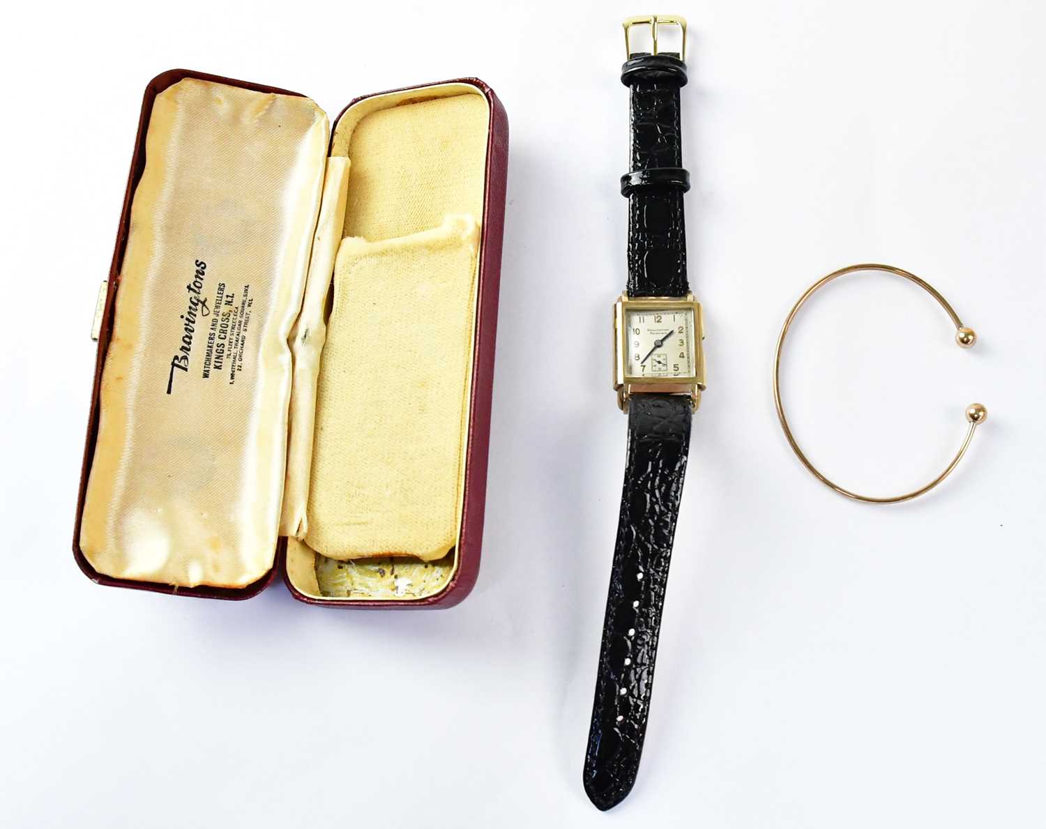 BRAVINGTONS RENOWN; a 9ct gold cased wristwatch, the square silvered dial set with Arabic numerals