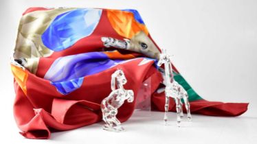 SWAROVSKI; three items, comprising a giraffe, a rearing horse and a scarf with an image of seven