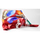 SWAROVSKI; three items, comprising a giraffe, a rearing horse and a scarf with an image of seven