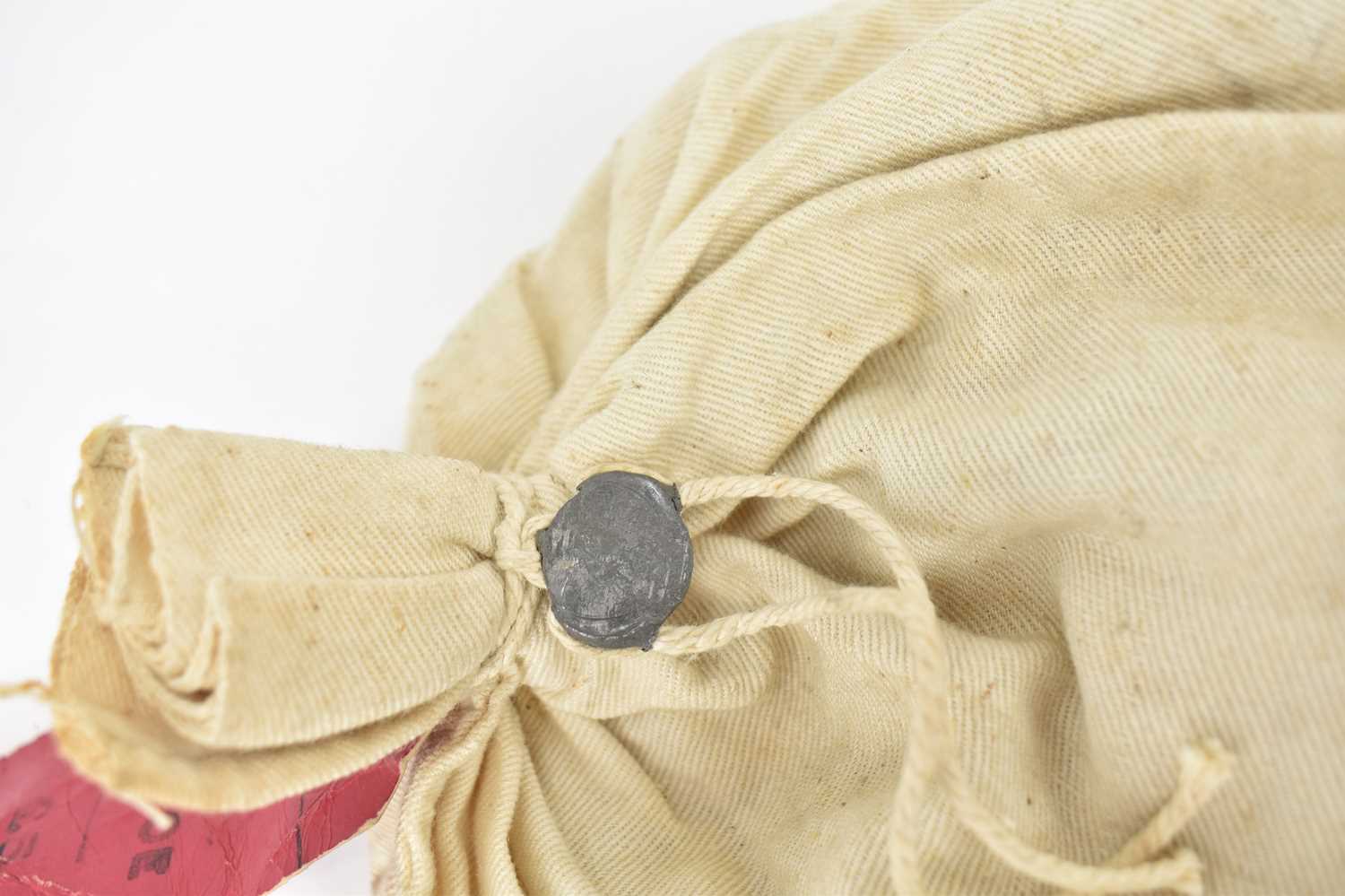 A lead sealed canvas bank bag containing a quantity of coins, the red tag states 'Pence' and the - Image 3 of 3