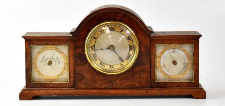 FINNIGANS; a burr walnut desktop combination clock/barometer centred with a silvered dial and gilt