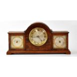 FINNIGANS; a burr walnut desktop combination clock/barometer centred with a silvered dial and gilt