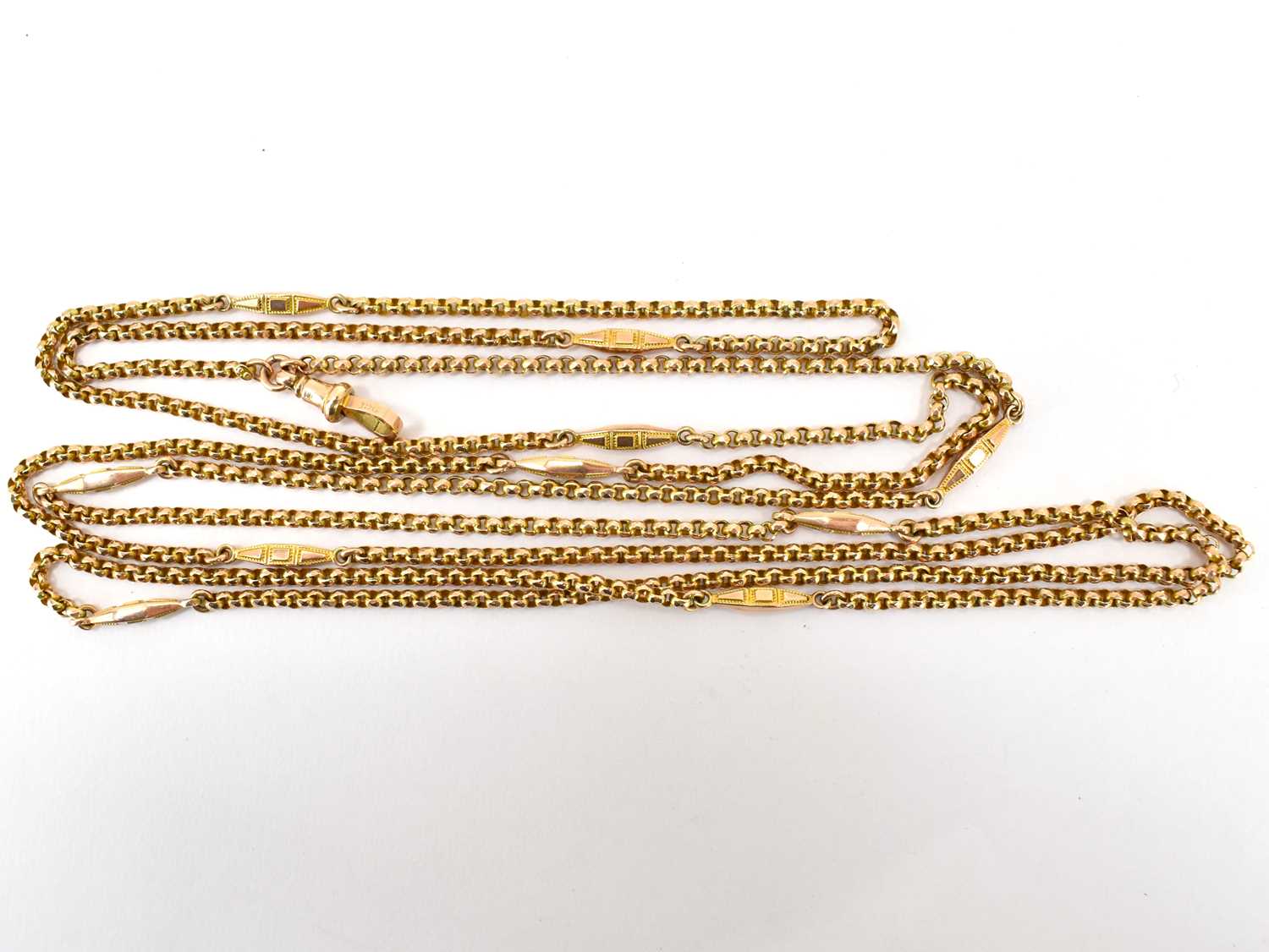 A 9ct rose gold Victorian-style muff chain with belcher links separated with gold lozenge links,