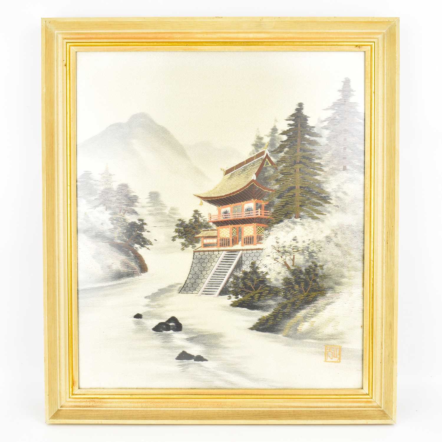 A vintage woven silk picture depicting pagoda on riverbank with pine trees to the side, water to the