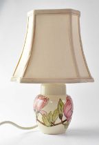 MOORCROFT; a 'Magnolia' pattern ginger jar shaped table lamp of shouldered tapering form, with