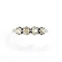 An 18ct white gold four-stone diamond ring, the head set with four claw set rose cut diamonds with a