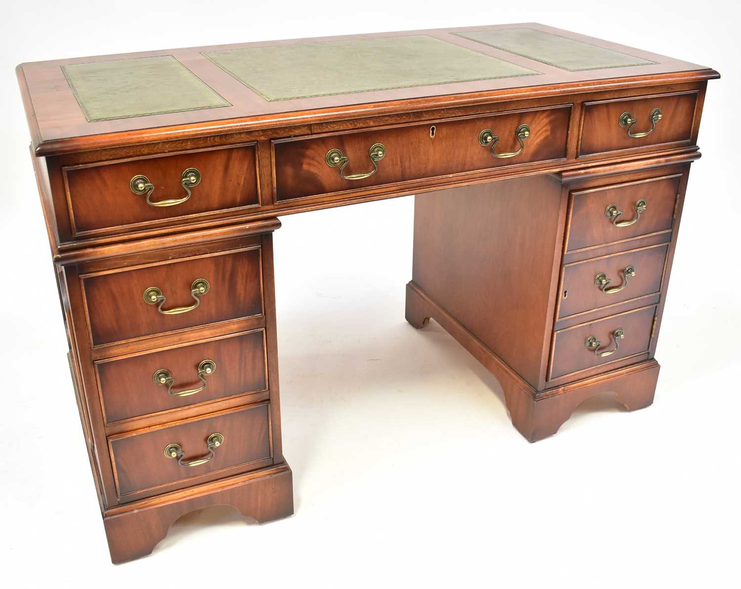 A modern mahogany pedestal desk, the three-section inlaid top with large central drawer flanked by