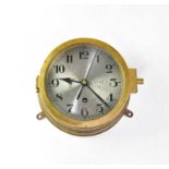 A WWII German Kriegsmarine U-Boat brass cased bulkhead clock, the 16cm silvered dial set with Arabic