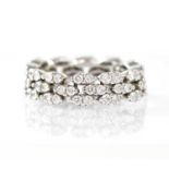 MAUBOUSSIN; an 18ct white gold 'Je le Veux' articulated ring, with three rows of marquise-shaped