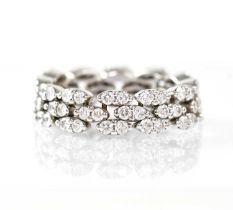 MAUBOUSSIN; an 18ct white gold 'Je le Veux' articulated ring, with three rows of marquise-shaped
