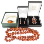 Various items of modern amber jewellery comprising graduated bead necklace, length 68cm, a silver