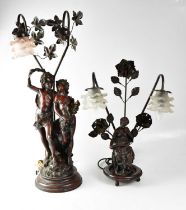 A figural spelter lamp base modelled as a young couple, with frosted glass shade (one shade