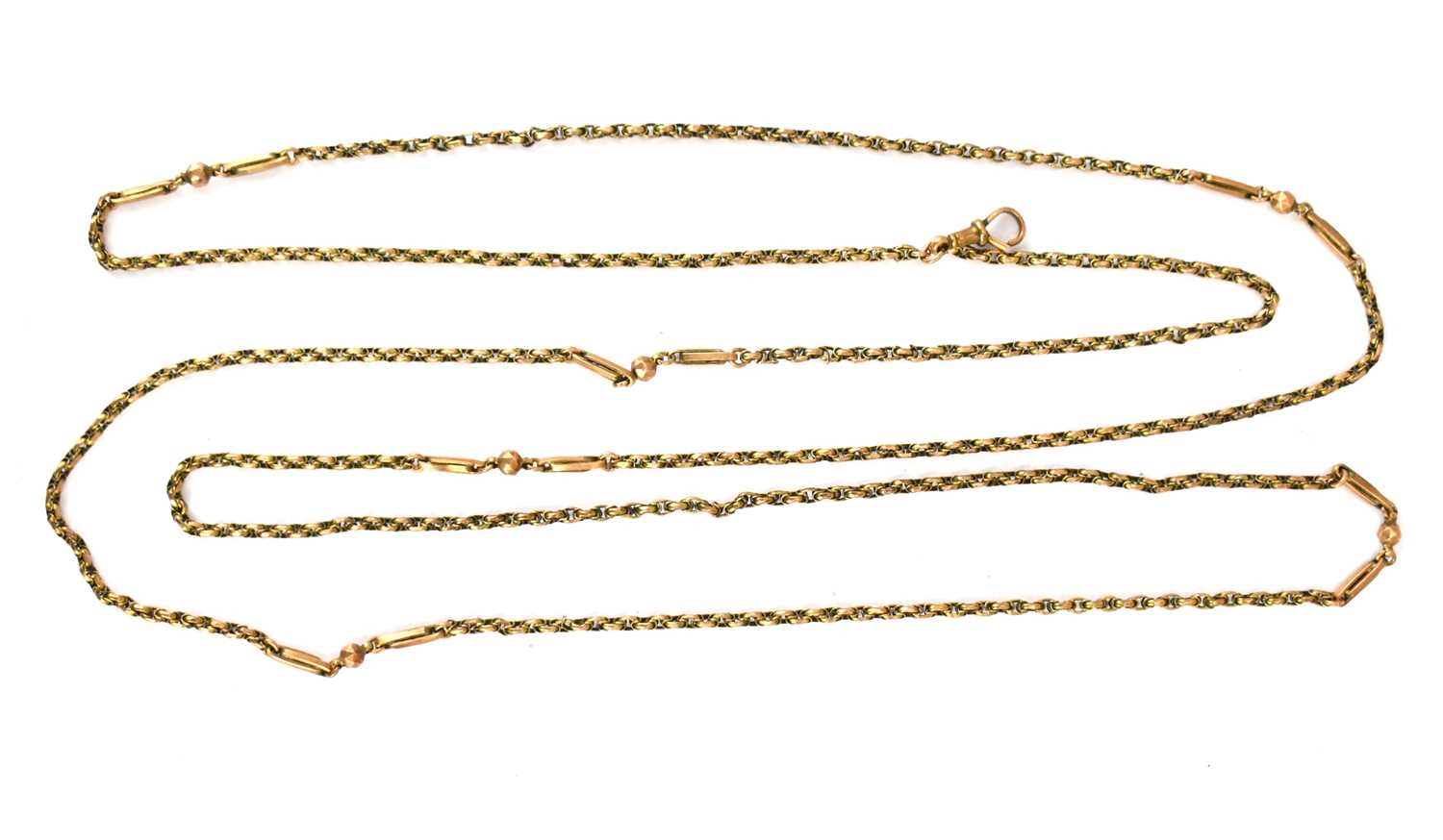 A 9ct rose gold muff chain with swivel clasp and tag which states 9ct, length 140cm, approx. 25.9g.