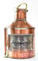 A Bow Port patent no. 23 ship's copper masthead lamp with curved clear lens and brass mounts, height