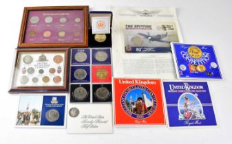 A quantity of various commemorative UK coinage, including two framed and glazed examples.