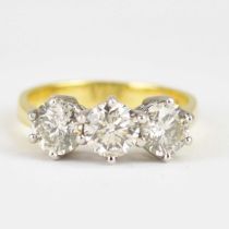 An 18ct yellow ring set with three claw set brilliant cut diamonds, each approx. 0.6ct, total 1.8ct,
