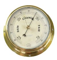 A N Lilley and Gillie Ltd brass cased marine barometer, with compensated dial, diameter 14cm.