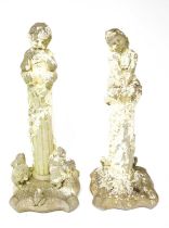 A pair of garden statues, one depicting Spring, modelled as a young girl sat on a column with mice