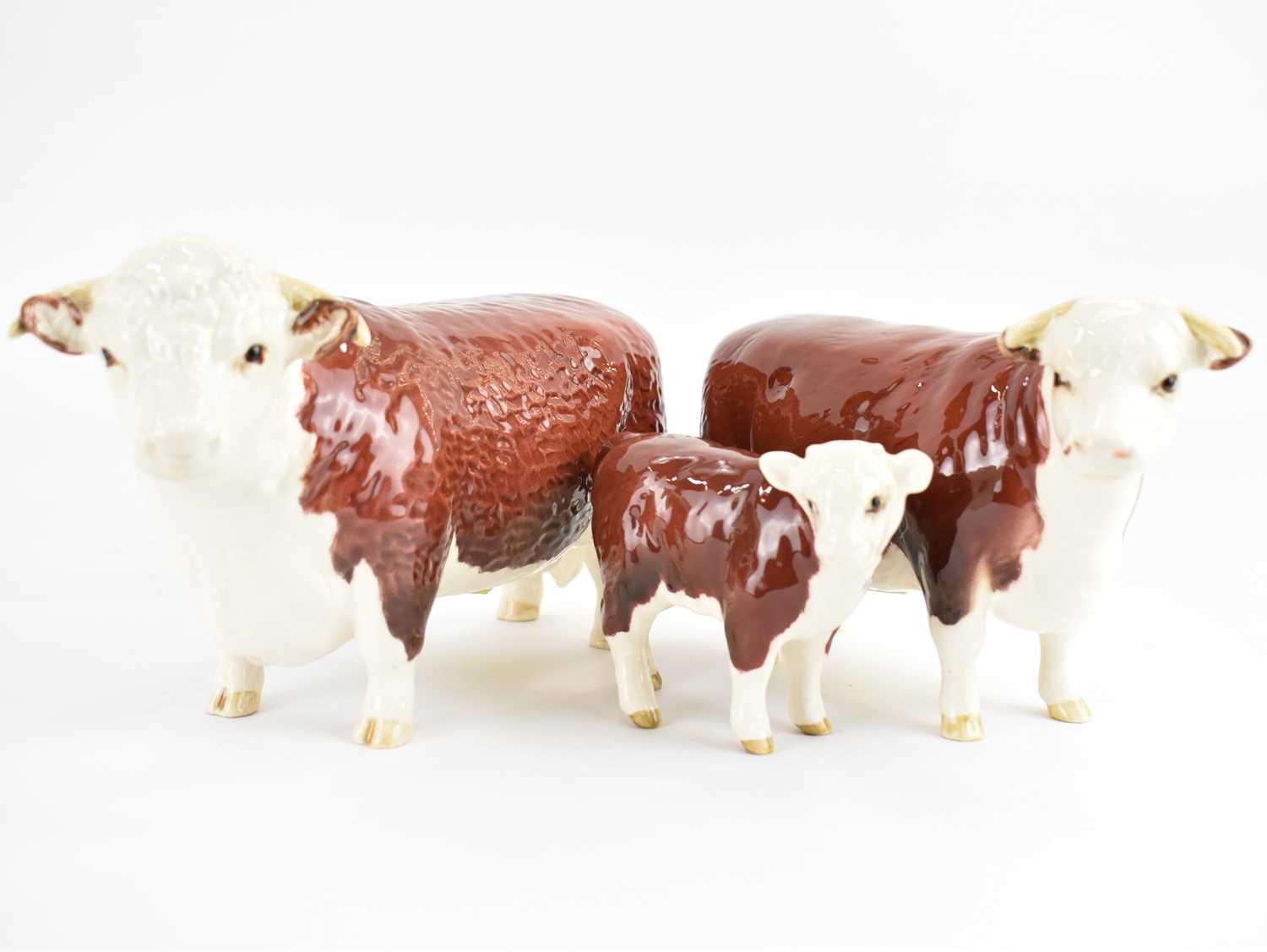 BESWICK; a Hereford family group, comprising Bull 1363A, Cow 1360 and Calf 1406B (3). Condition