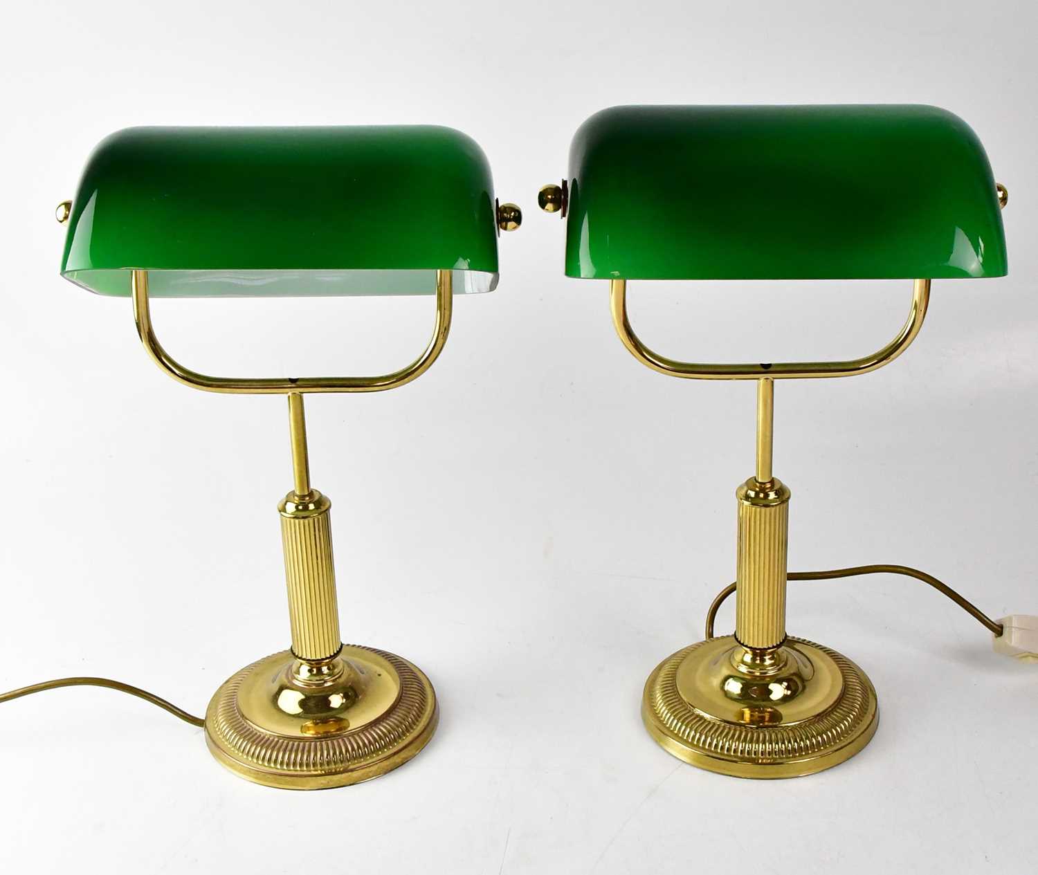 A pair of library lamps with green glass shades, height of each 38cm (2). Condition Report: - This