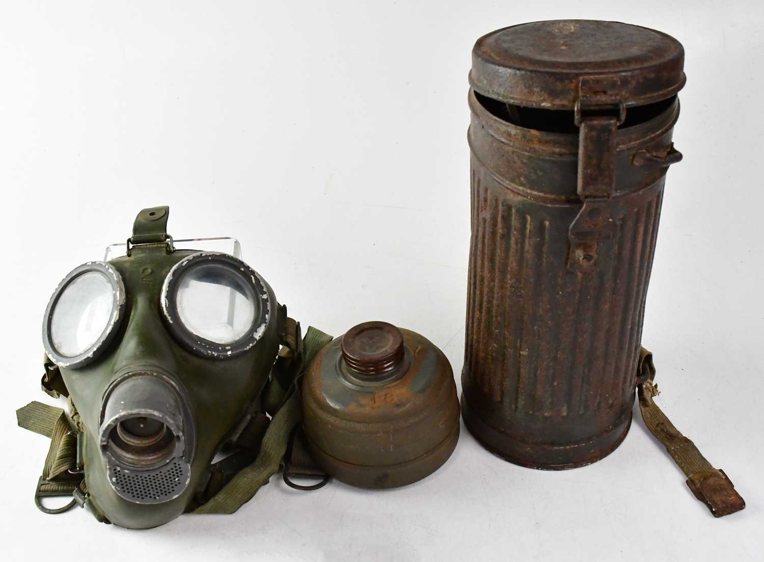 A WWII German M30 gas mask with FE41 filter in original tin, a WWI period French M15 infantry helmet - Image 3 of 3