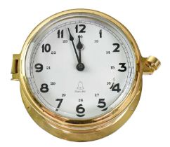 A Bay Berk International mariners 'Ship's Bell' clock in brass porthole case, diameter 14cm.