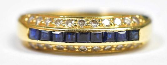 An 18ct gold diamond and sapphire ring, the four central channel set square cut sapphires flanked by