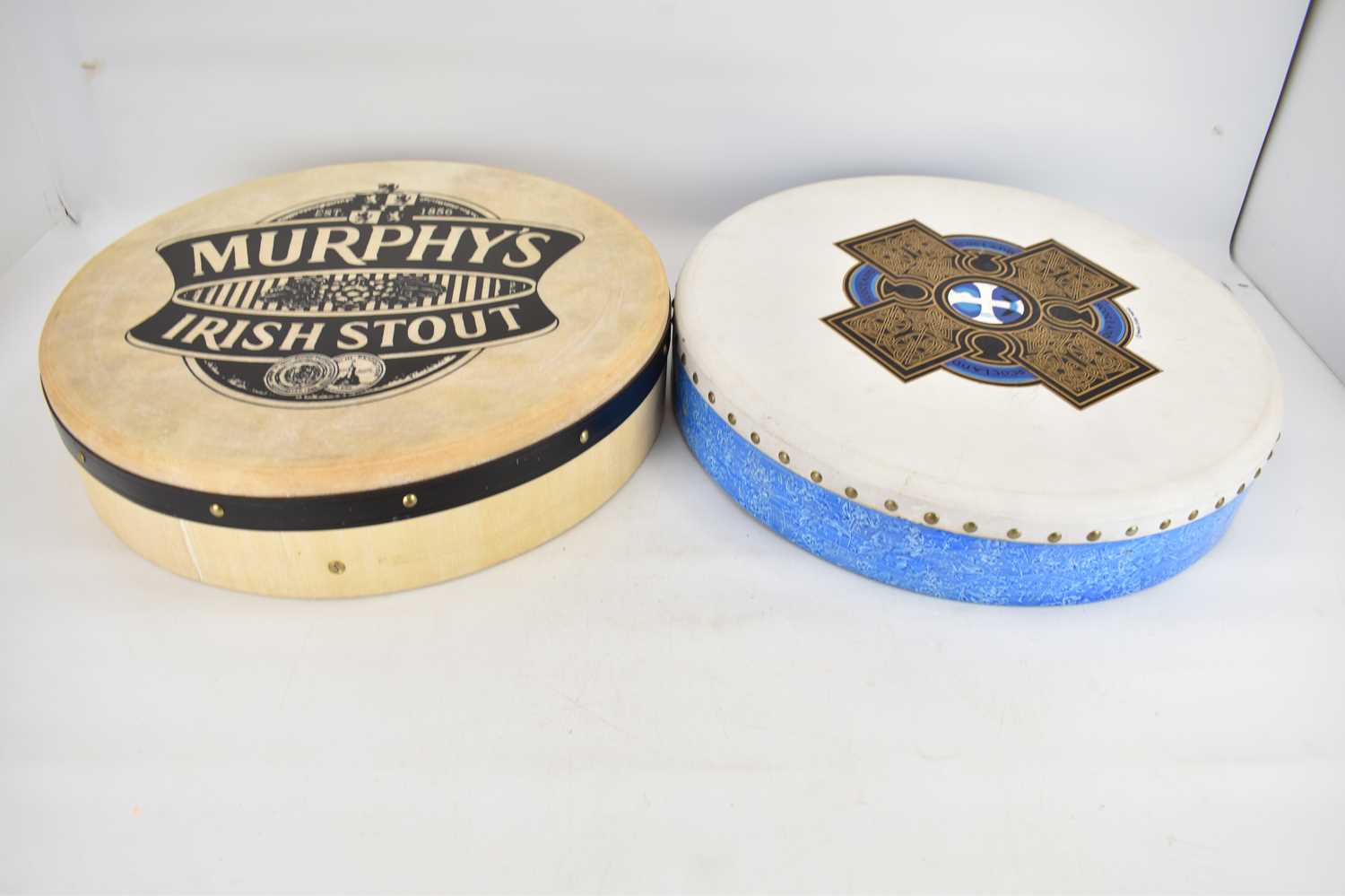 Two bodharan drums comprising 'Murphy's Irish Stout' and 'Hewlin' with Celtic design, both with - Image 2 of 3