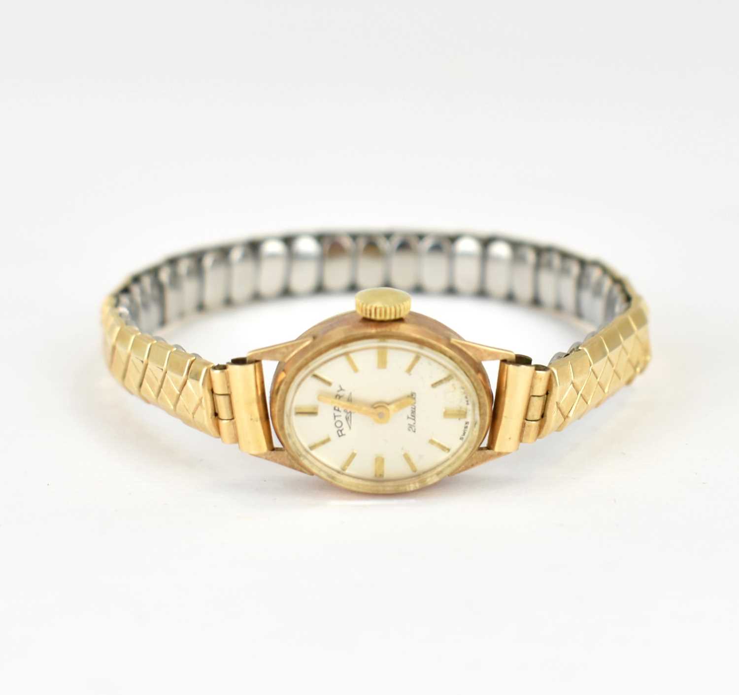 ROTARY; a ladies' 9ct gold wristwatch, the oval silvered dial set with raised baton numerals,