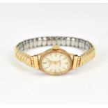 ROTARY; a ladies' 9ct gold wristwatch, the oval silvered dial set with raised baton numerals,